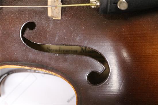 A Rosetti violin bearing faux Stradivarius label, cased with bow